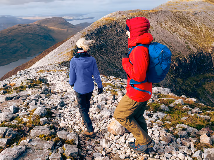 Two people hiking in the mountains.