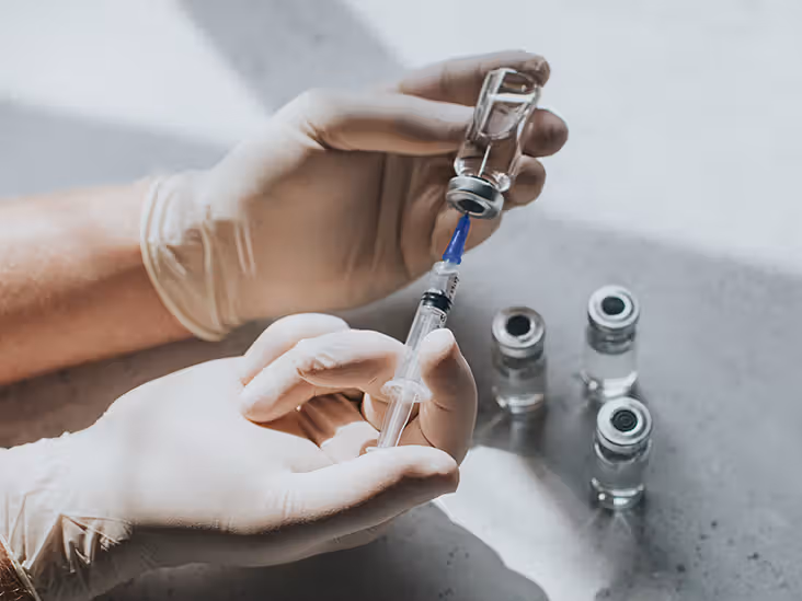 A healthcare professional preparing a shingles vaccine.