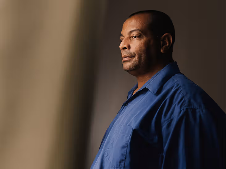 An older adult looking pensive.