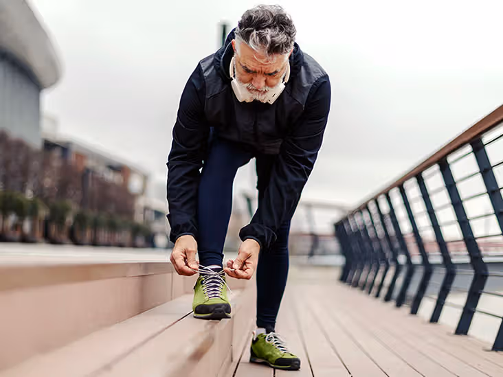 An older adult getting ready for a run.